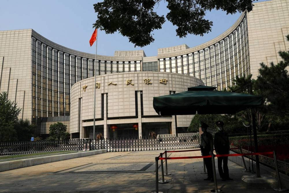 Paramilitary police officers stand guard in front of the headquarters of the People’s Bank of China, the central bank, in Beijing, China September 30, 2022. ― Reuters pic