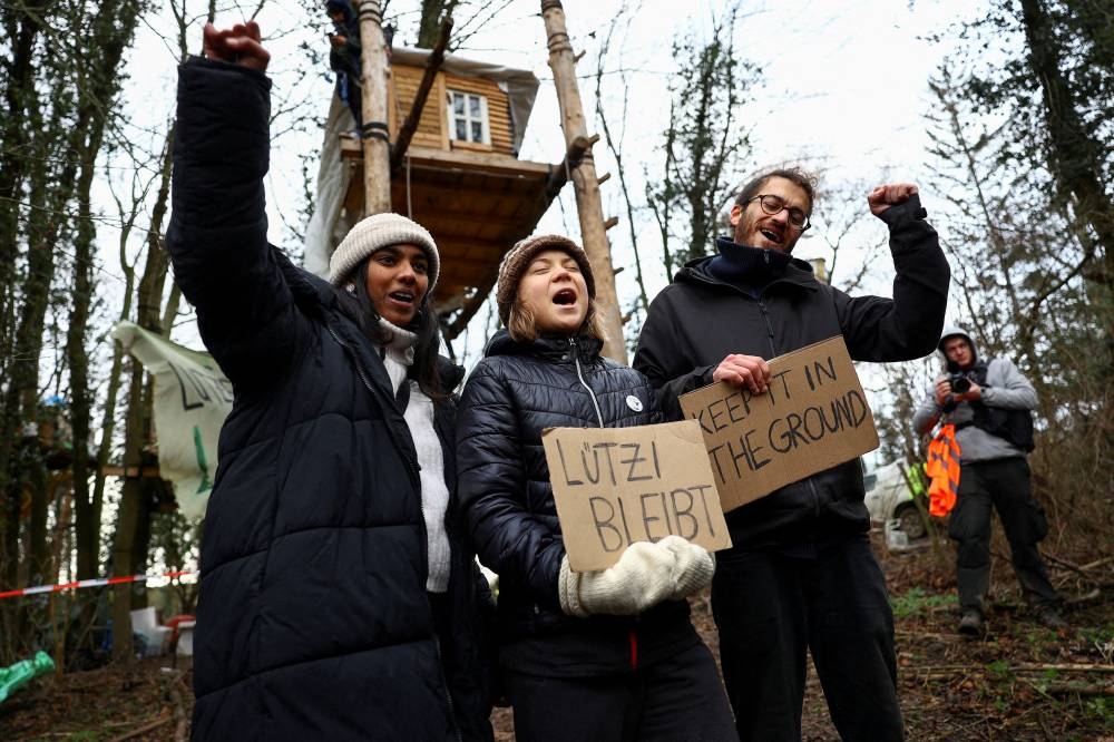 Climate activist Greta Thunberg joins the activists protesting against the expansion of the Garzweiler open-cast lignite mine of Germany's utility RWE to Luetzerath, in Keyenberg, Germany, January 14, 2023. ― Reuters pic