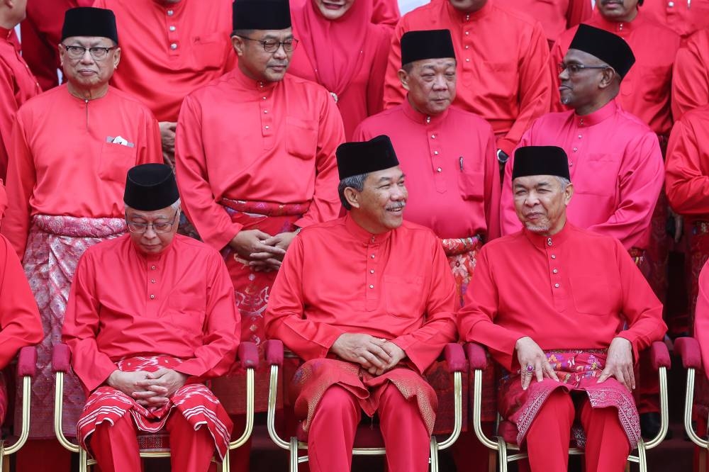 (L to R) Umno vice-president Datuk Seri Ismail Sabri Yaakob,Umno deputy president Datuk Seri Mohamad Hasan and Umno president Datuk Seri Ahmad Zahid Hamidi are pictured during its general assembly at World Trade Centre in Kuala Lumpur January 13, 2023. — Picture by Yusof Mat Isa