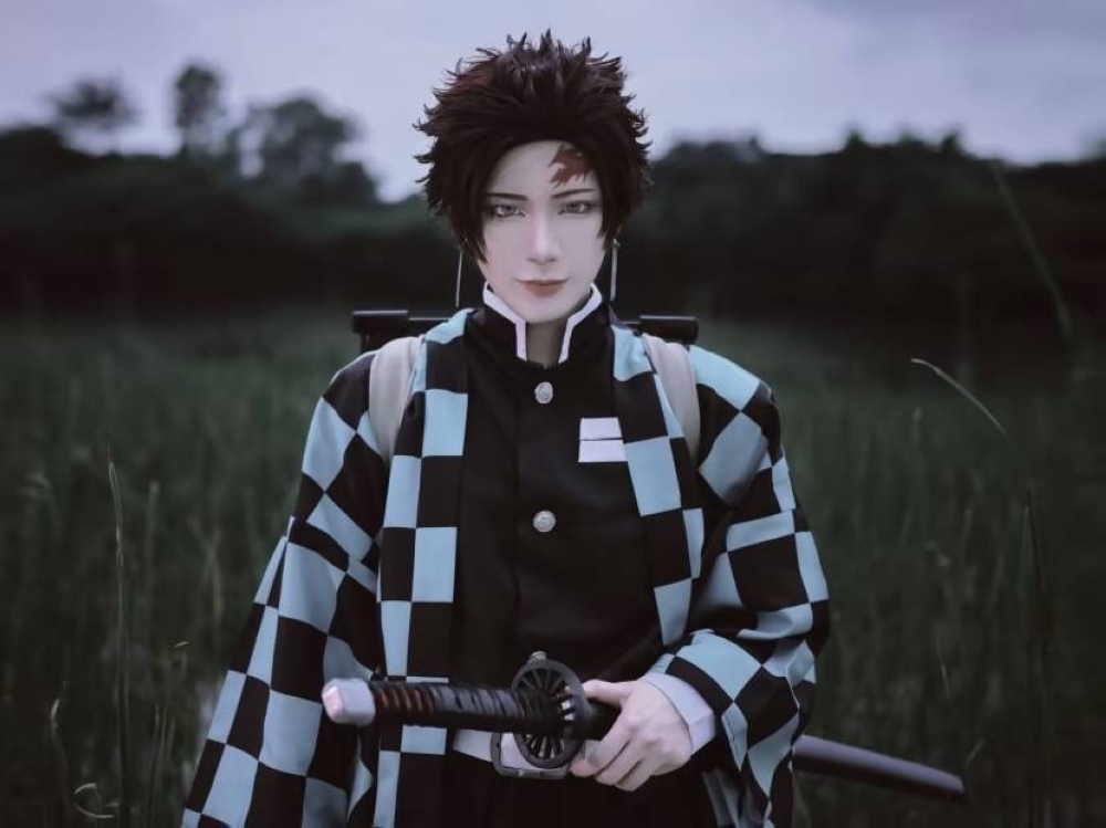 Cosplayer Maoru dressed up as anime character Tanjiro Kamado from Demon Slayer: Kimetsu no Yaiba. — Picture courtesy of Maoru via TODAY