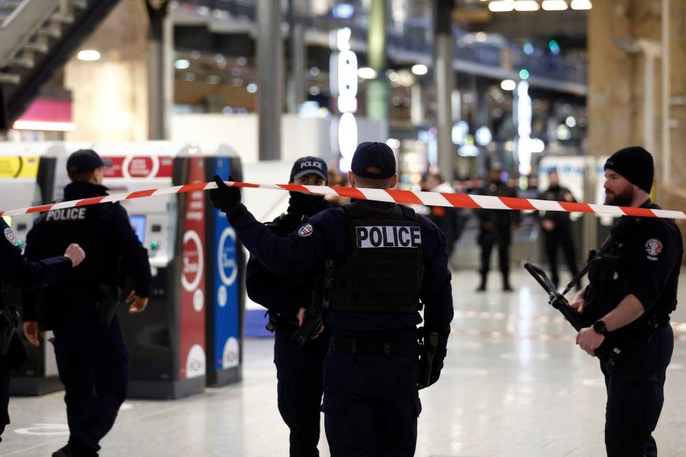 French police secure the area after a man with a knife wounded several people at the Gare du Nord train station in Paris, France, January 11, 2023. — AFP pic