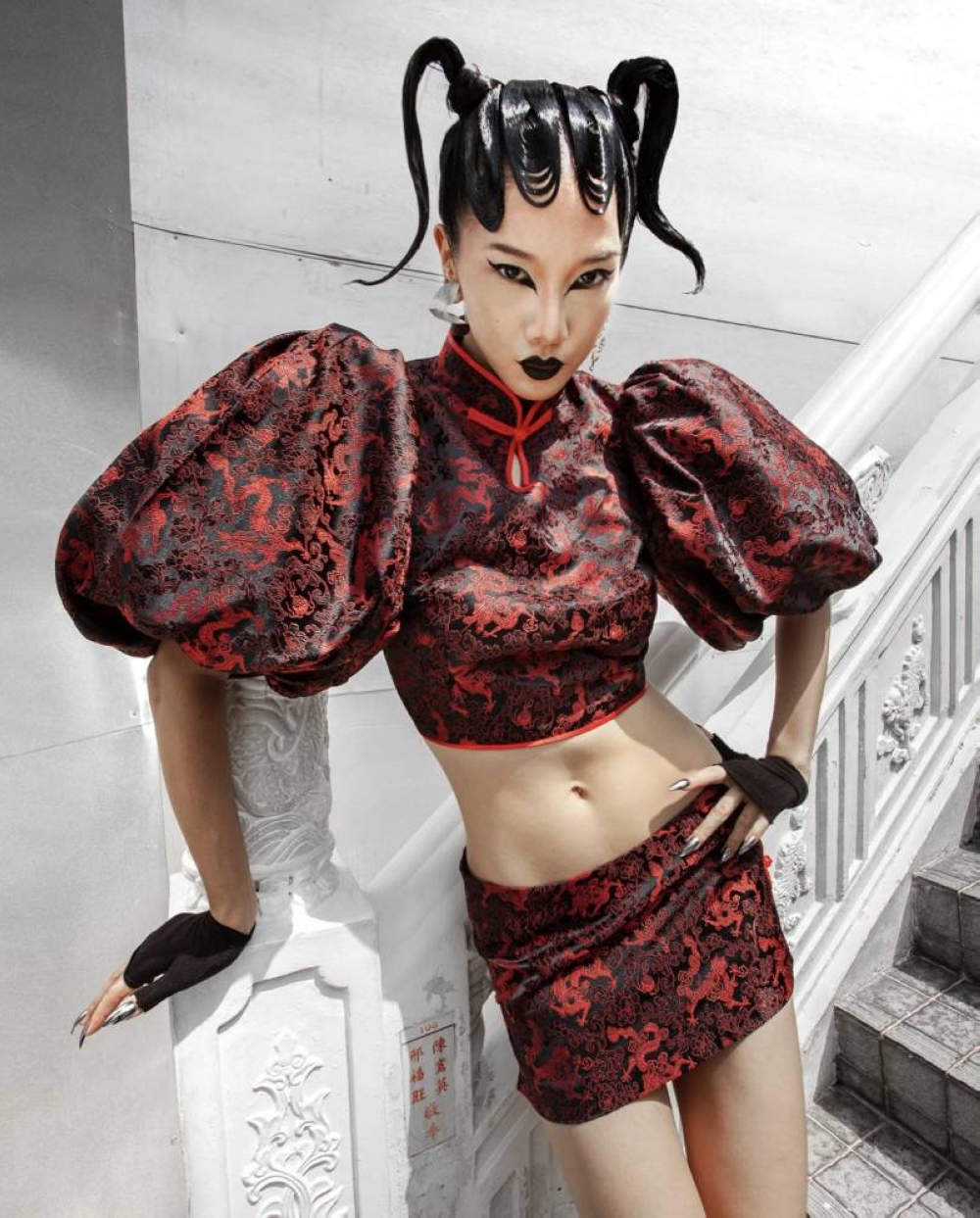 From Behati, an alluring qipao dragon top with puff sleeves and mini skirt.  — Image courtesy of Behati