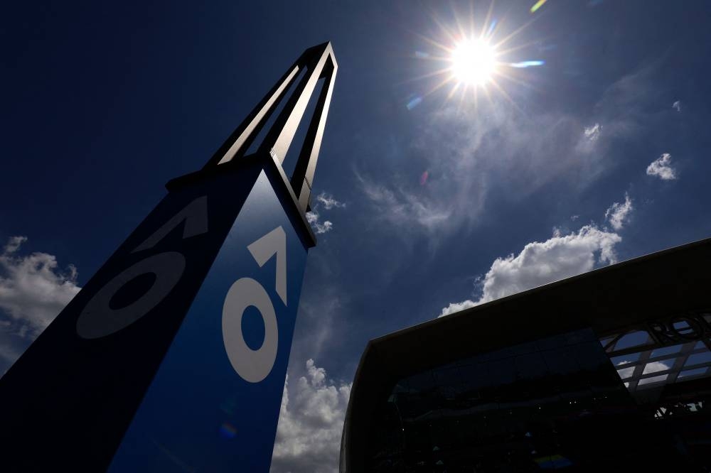 A scorching sun shines above the Melbourne Park as the games on the outside courts are suspended due to extreme heat on day two of the Australian Open tennis tournament in Melbourne on January 17, 2023. — AFP pic