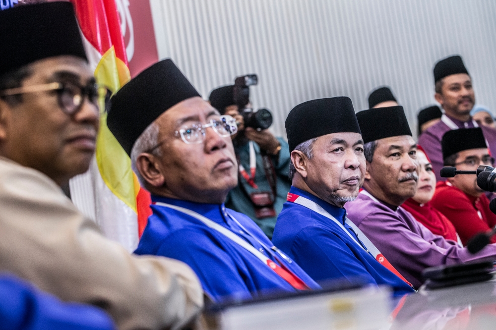 Umno president Datuk Seri Ahmad Zahid Hamidi (centre) is seen during Umno's general assembly (PAU 2022) at World Trade Centre Kuala Lumpur January 14, 2023. — Picture by Hari Anggara