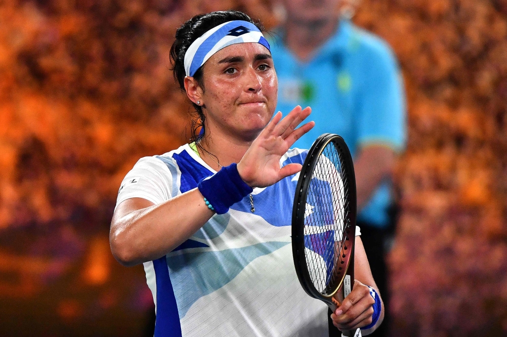 Tunisia's Ons Jabeur celebrates victory against Slovenia's Tamara Zidansek after their women's singles match on day two of the Australian Open tennis tournament in Melbourne on January 17, 2023. — AFP pic