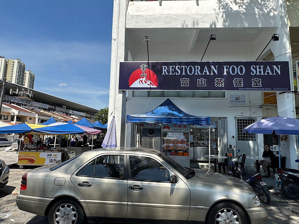 The coffee shop is relatively new and offers seats outside under a canopy.