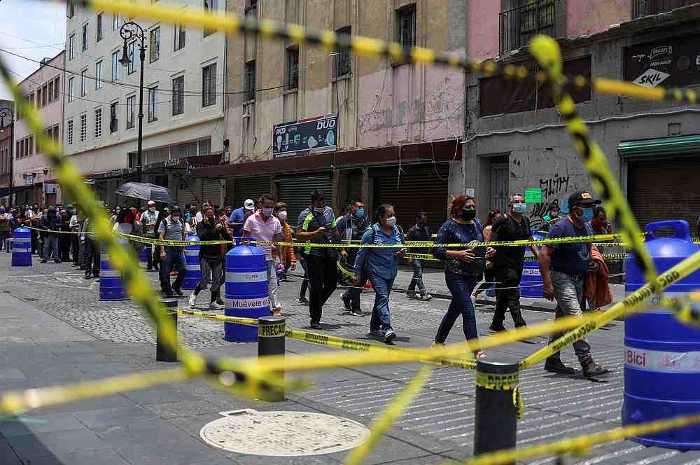 File photo of people walking along the street before entering the area where stores are open as the Covid-19 outbreak continues, in Mexico City, Mexico July 6, 2020. - Reuters pic