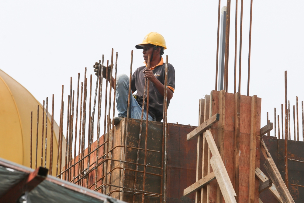 A foreign workers is pictured at a construction site in Kuala Lumpur January 13, 2023. ― Picture by Choo Choy May .