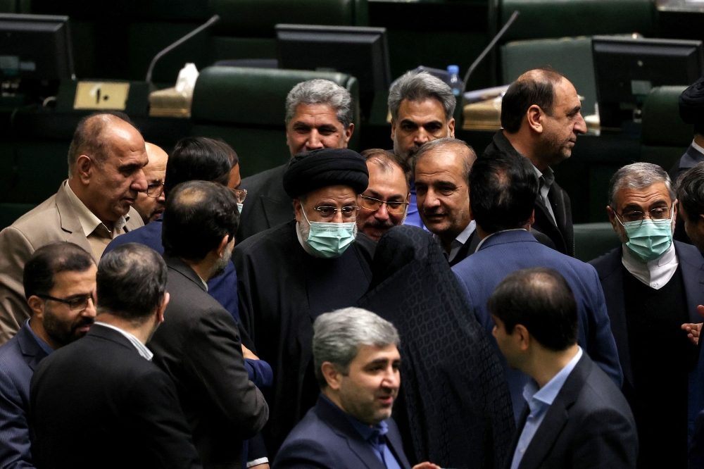 Iranian President Ibrahim Raisi arrives at the parliament in the capital Tehran, to address lawmakers on his budget bill, on January 22, 2023. ― AFP pic