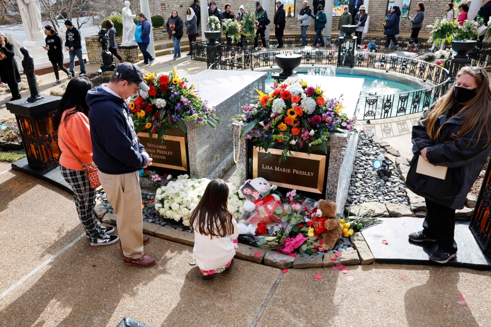 Fans visit the grave of Lisa Marie Presley during her memorial on January 22, 2023 in Memphis, Tennessee. — AFP pic