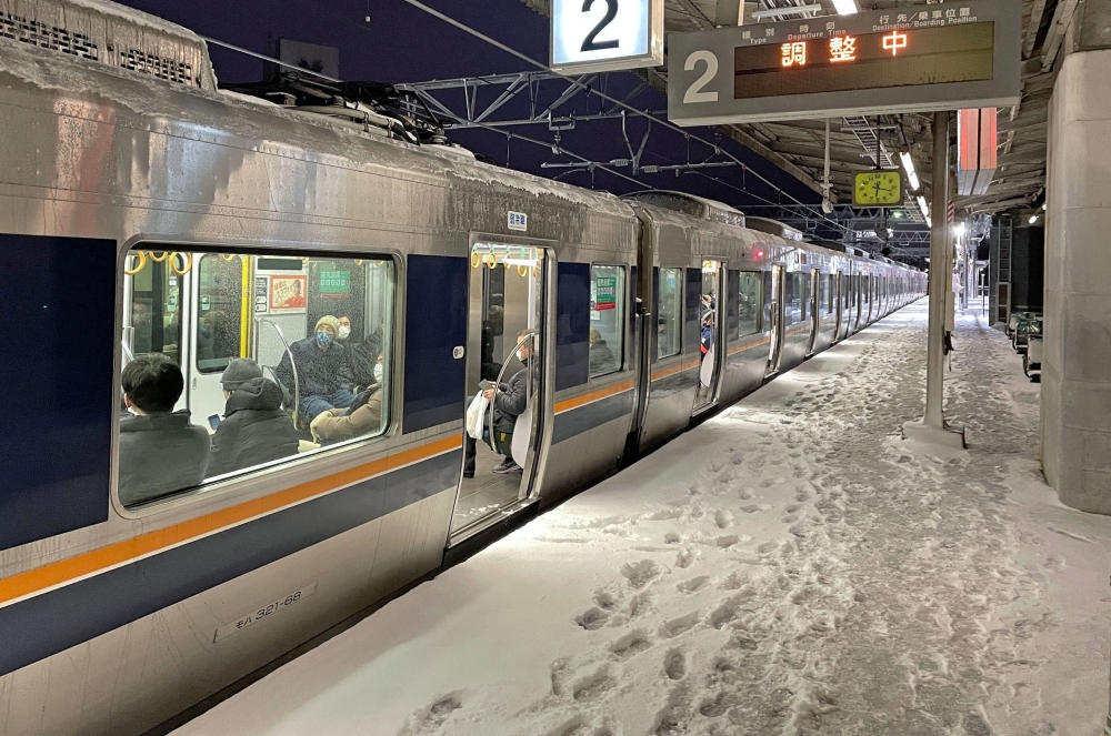 A train is stranded at Nishioji station in Kyoto, Japan in this photo provided by Kyodo on January 25, 2023. ― Kyodo/via Reuters