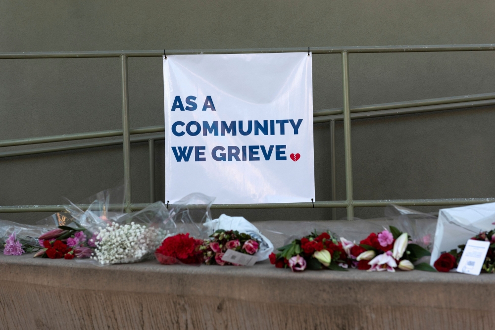 Flowers are pictured in a public square near the City Hall to honor the victims, the day after a mass shooting at two locations in the coastal city of Half Moon Bay, California January 24, 2023. — Reuters pic