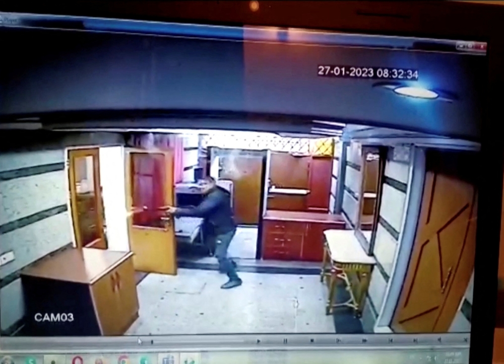 An armed assailant shoots at security guards in Azerbaijan embassy in Tehran, Iran January 27, 2023 in this still image obtained from a CCTV footage by Reuters. — Reuters pic