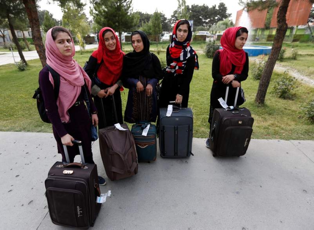 File photo of members of Afghan robotics girls team arriving to receive their visas from the US embassy in Kabul July 13, 2017. - Reuters pic