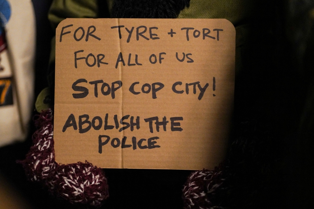 A person holds a sign during a protest following the release of videos showing Memphis police officers beating Tyre Nichols, who died while hospitalised three days later, in New York January 28, 2023. — Reuters pic