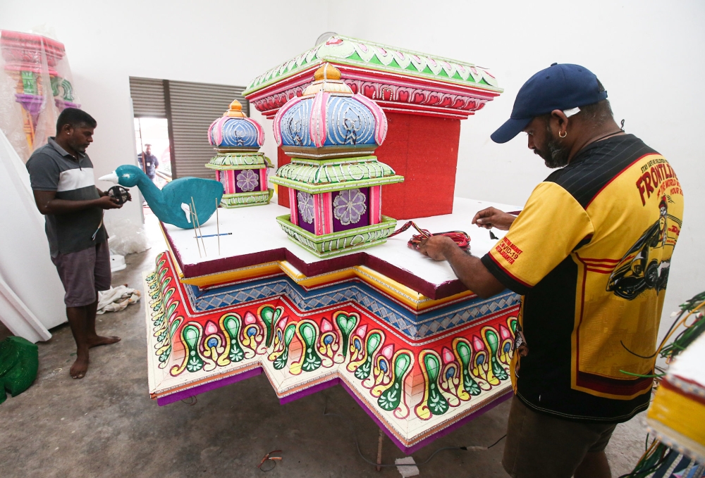 'Kavadi' makers fixing the LED on the kavadi at their workshop in Taman Rishah in Ipoh.
