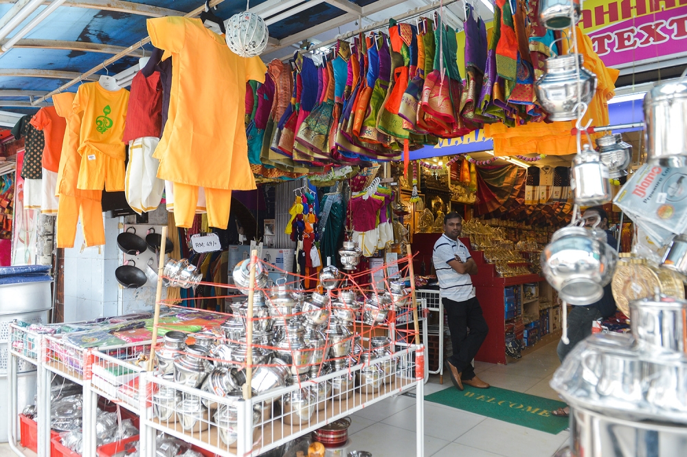 A shop worker is seen at a store selling Thaipusam goods at Little India, Klang on January 30, 2023. — Picture by Miera Zulyana
