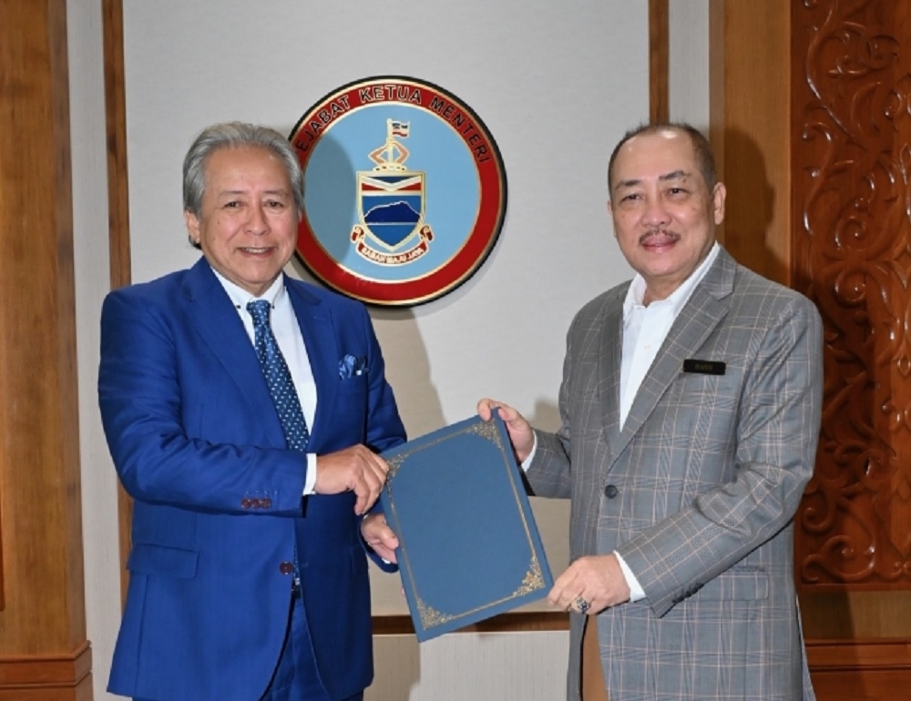 Datuk Seri Anifah Aman (left) receives his appointment letter from Sabah Chief Minister Datuk Seri Hajiji Noor at Menara Kinabalu in Kota Kinabalu, on January 30, 2023. — Picture courtesy of the Sabah Chief Minister’s Office