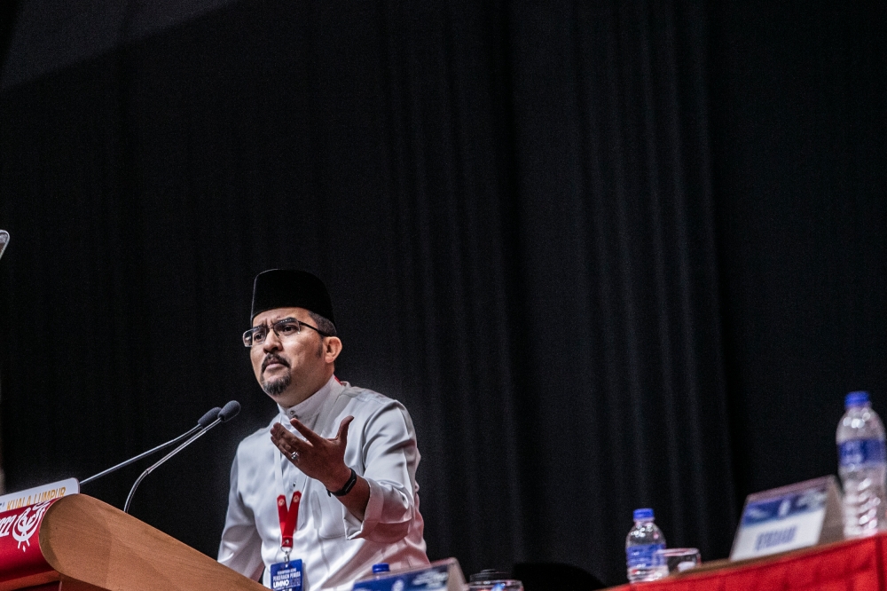 Umno Youth chief Datuk Asyraf Wajdi Dusuki delivered a keynote speech at the Umno Youth Conference during the Umno's general assembly (PAU 2022) at World Trade Centre Kuala Lumpur January 12, 2023. — Picture by Hari Anggara
