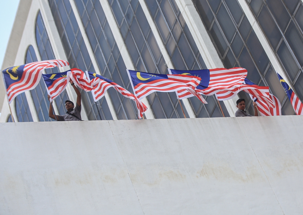The Ipoh City Council building is decked with the Jalur Gemilang in conjunction with Merdeka Day on August 31, 2022. Malaysia fell one spot in the 2022 Economist Intelligence Unit democracy index released yesterday, ranking 40th globally and scoring among the worst for civil liberties. — Picture by Farhan Najib