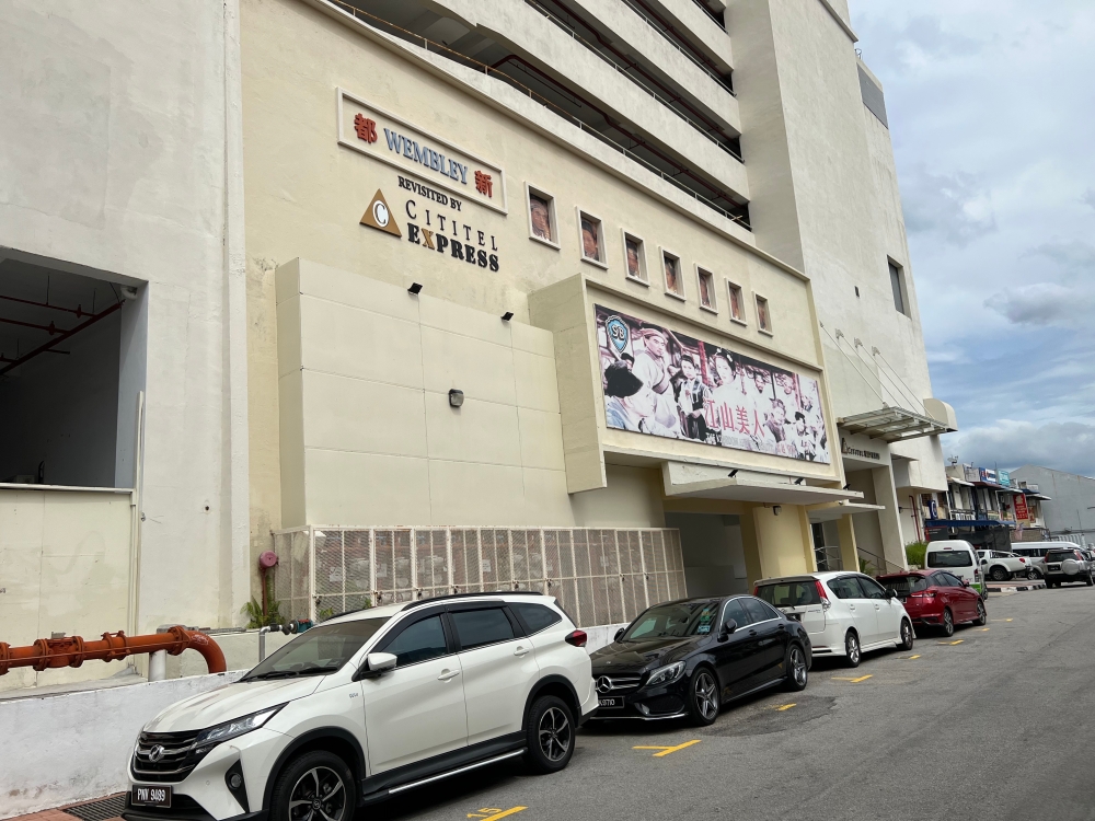 The Wembley cinema building on Noordin Street was demolished but its facade was retained as the front of a hotel. — Picture by Opalyn Mok