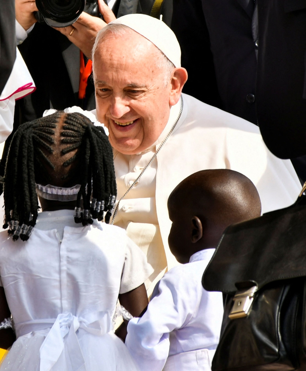Pope Francis meets children as he arrives for a meeting with priests, deacons, consecrated people and seminarians at the Cathedral of Saint Therese during his apostolic journey, in Juba, South Sudan, February 4, 2023. ― Reuters pic
