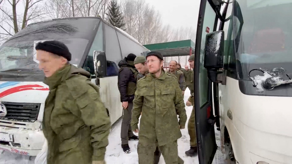 A still image from video, released by Russia’s Defence Ministry, shows what it said to be captured Russian service personnel leaving a bus following the latest exchange of prisoners of war at an unknown location in the course of Russia-Ukraine conflict, in this image taken from handout footage released February 4, 2023. ― Reuters pic