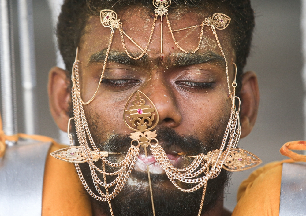A devotee is seen in performing his vows in conjunction with Thaipusam at the Sri Maha Mariamman Temple in Buntong, Ipoh. — Picture by Farhan Najib