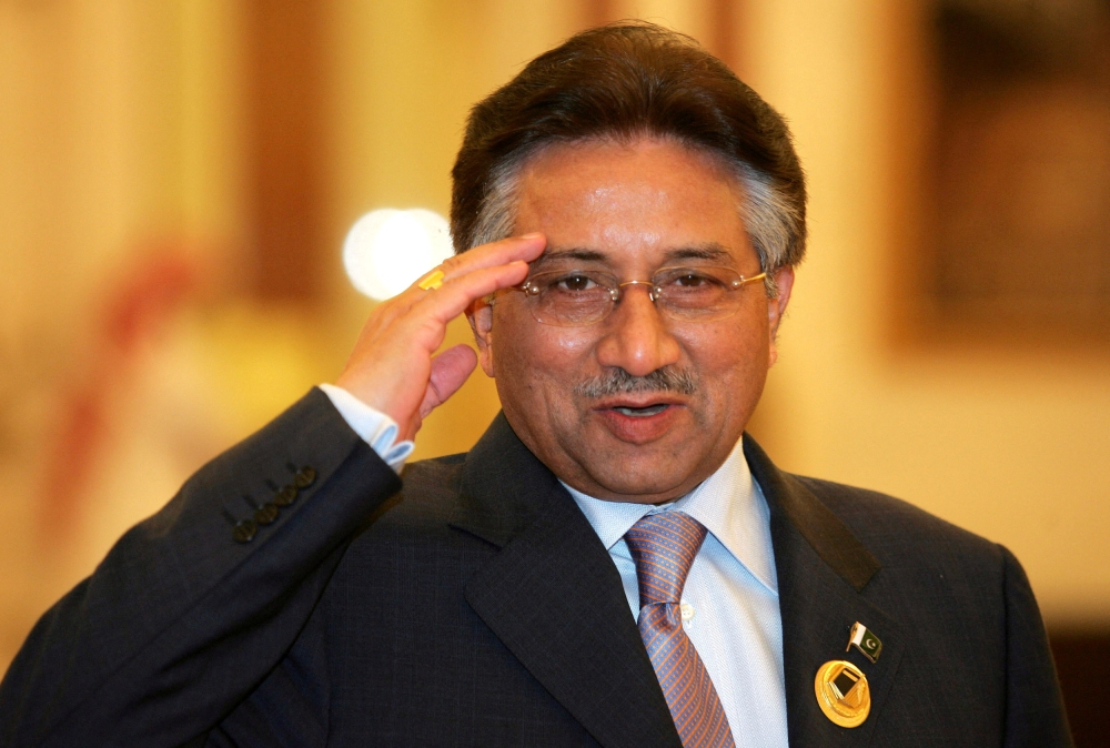 Pakistani President Pervez Musharraf salutes as he arrives for the Organisation of Islamic Conference (OIC) meeting in Mecca December 8, 2005. — Reuters pic