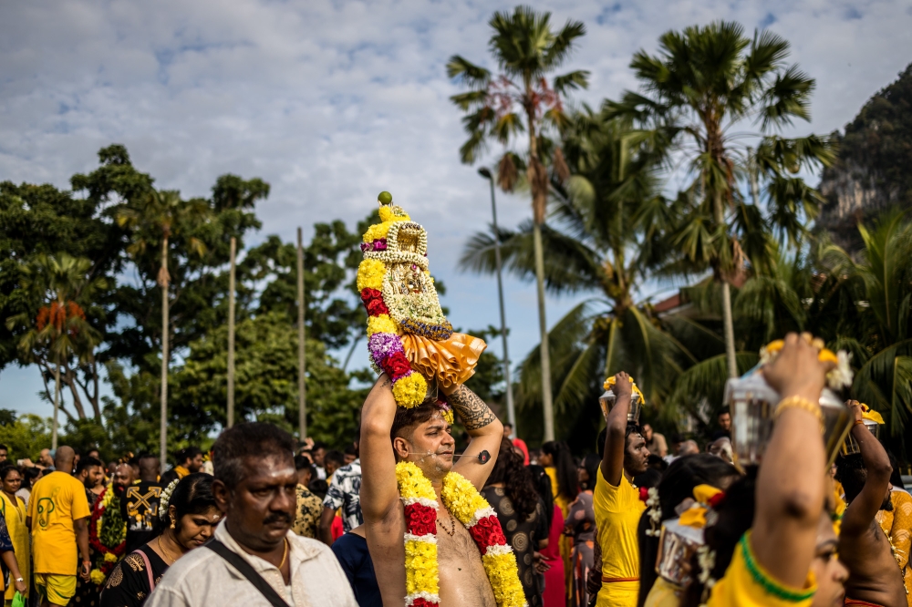 Hindu devotees carry offerings on their heads during Thaipusam celebration at Batu Caves February 5, 2023. — Picture by Firdaus Latif