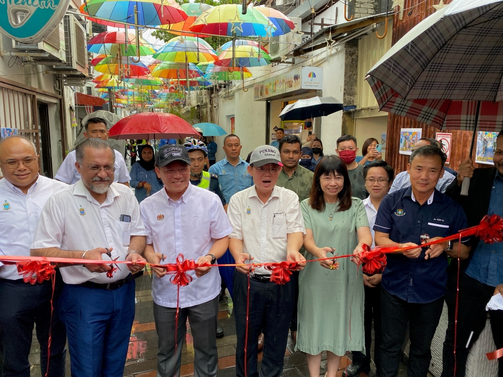 Local Government Development Minister Nga Kor Ming (3rd left) and Penang Chief Minister Chow Kon Yeow (4th left) at the official launch of the upgraded Armenian Street back lane February 6, 2023. — Picture by Opalyn Mok