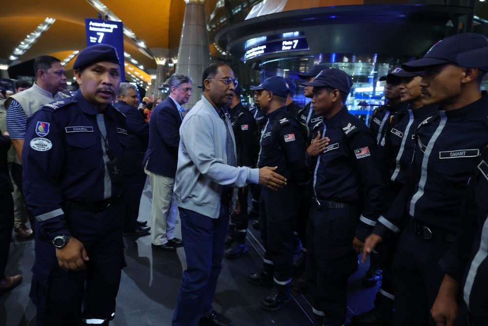 Foreign Minister Datuk Seri Zambry Abd Kadir greets the SMART personnel leaving for Turkey, at the Kuala Lumpur International Airport in Sepang February 6, 2023. — Bernama pic