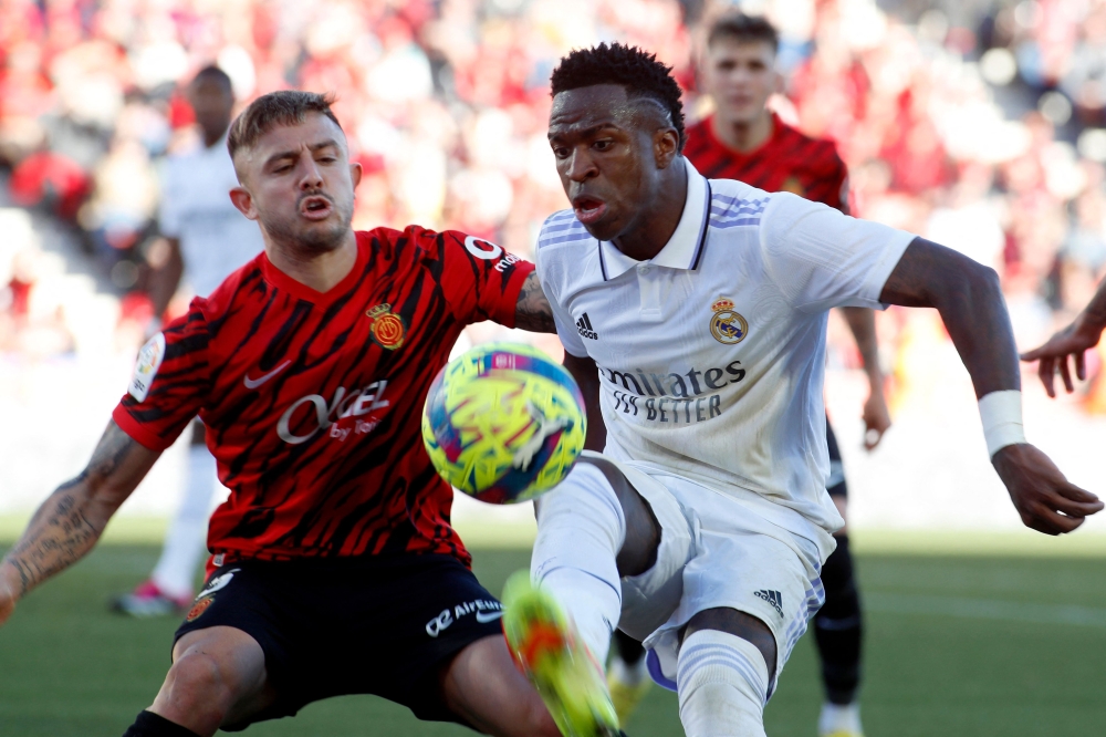 Real Madrid's Vinicius Junior (right) in action with Mallorca's Pablo Maffeo during the match at the Visit Mallorca stadium in Palma de Mallorca February 5, 2023. ― AFP pic