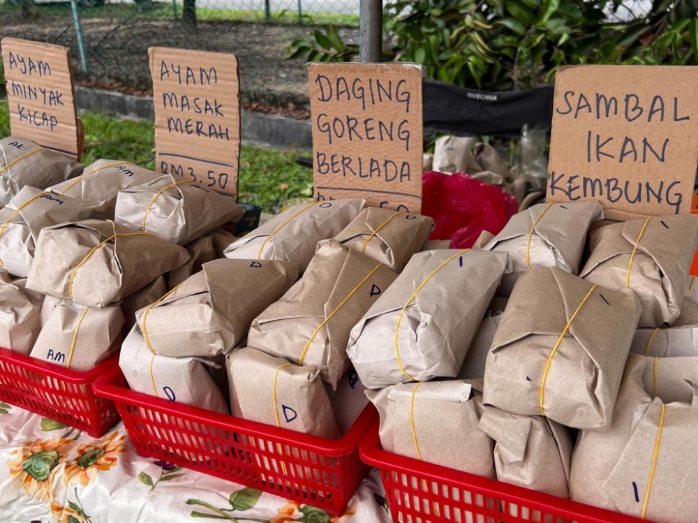 When some of her customers can’t pay or have RM5 left until payday, she gives it for free and tells them to pay when they can. — Picture courtesy of Nurul Shima