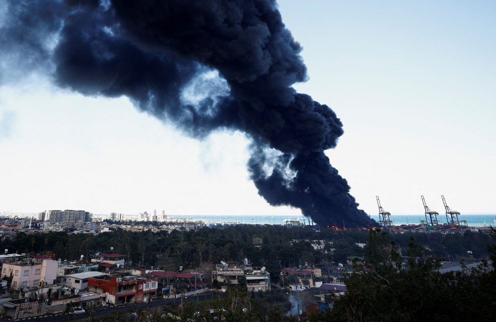 Smoke rises from a fire at the port of Iskenderun following an earthquake in Turkey, February 7, 2023. — Reuters pic
