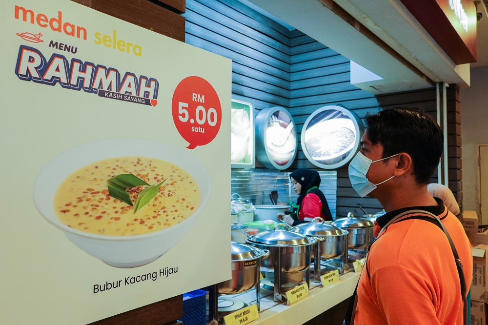 A poster showing a Menu Rahmah meal are seen at an eatery at Mydin USJ February 6, 2023. — Picture by Miera Zulyana