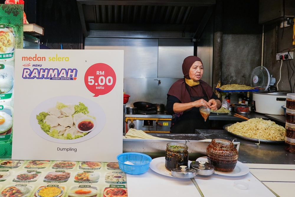 A poster showing a Menu Rahmah meal are seen at an eatery at Mydin USJ February 6, 2023. — Picture by Miera Zulyana