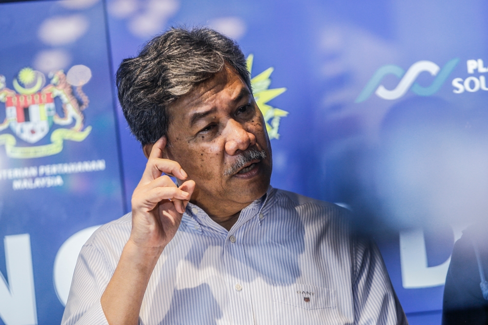 Defence Minister Datuk Seri Mohamad Hasan (centre) speaks to the media at a press conference at Sateria Residensi Platinum South Valley, Sungai Besi January 25, 2023. — Picture by Hari Anggara