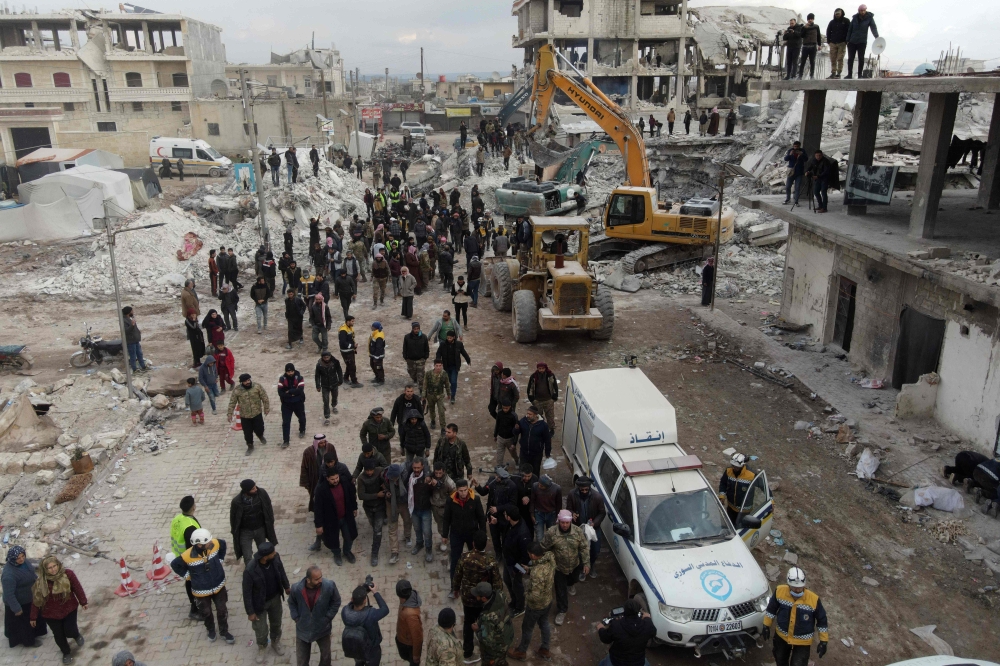 An ambulance waits to evacuate victims, as search and rescue operations continue days after a deadly earthquake hit Turkey and Syria, in the town of Jindayris, in the rebel-held part of Aleppo province, on February 10, 2023. ― AFP pic