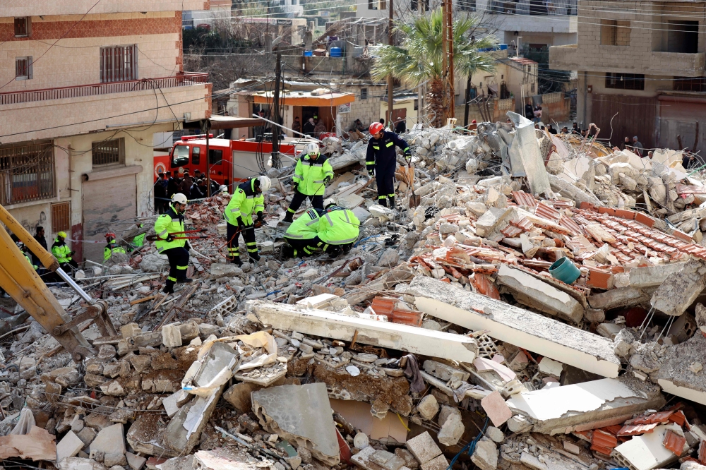 Emirati rescuers sift through the rubble of a collapsed building in the regime-controlled town of Jableh in the province of Latakia, northwest of the Syrian capital, on February 11, 2023, in the aftermath of a deadly earthquake. ― AFP pic