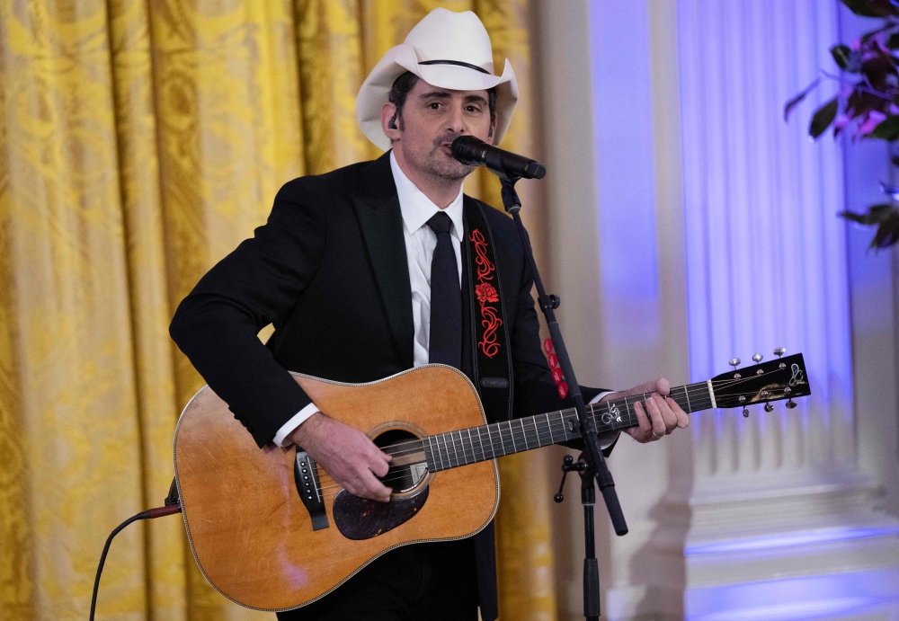 Country singer Brad Paisley sings after a black-tie dinner for Governors and their spouses at the White House in Washington, DC on February 11, 2023. — AFP pic