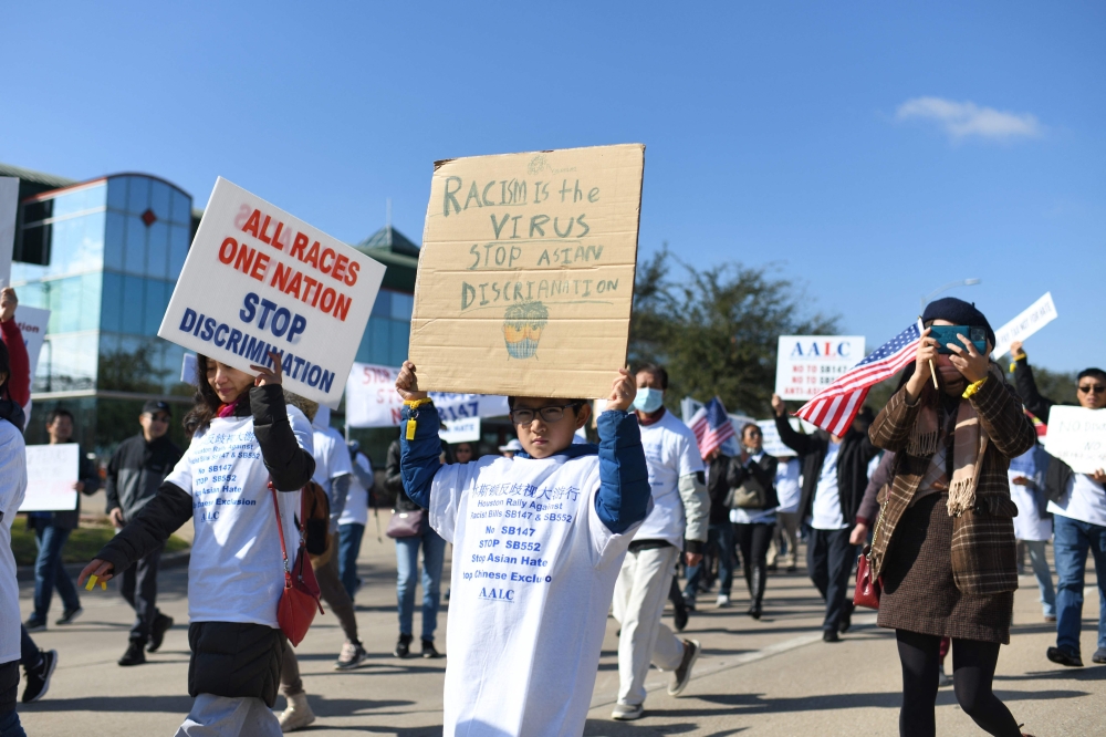 Demonstrators hold a protest in Houston, Texas, against a bill that would forbid Chinese nationals from buying properties in Texas, on February 11, 2023. — AFP pic