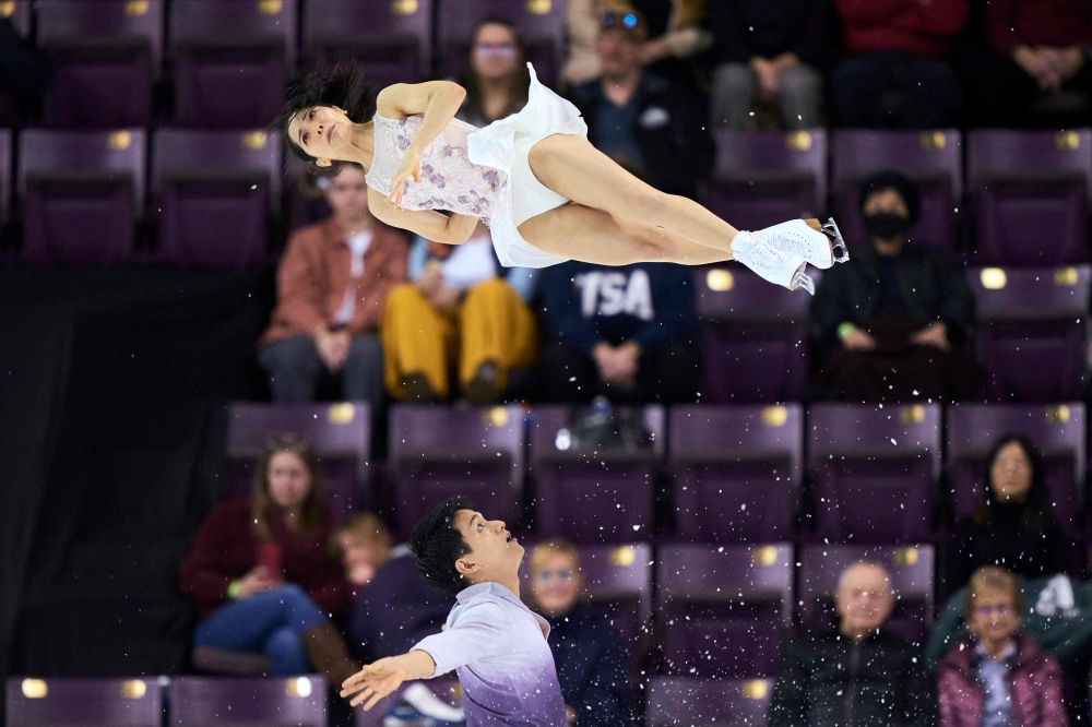 Japan's Riku Miura (top) and Ryuichi Kihara skate their free skate in the pairs competition during the ISU Four Continents Figure Skating Championships 2023 at the Broadmoor World Arena in Colorado Springs, Colorado, on February 11, 2023. — AFP pic
