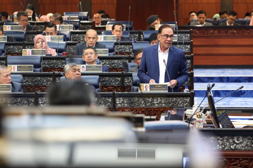 Prime Minister Datuk Seri Anwar Ibrahim speaks at the Parliament in Kuala Lumpur February 14, 2023. — Bernama pic