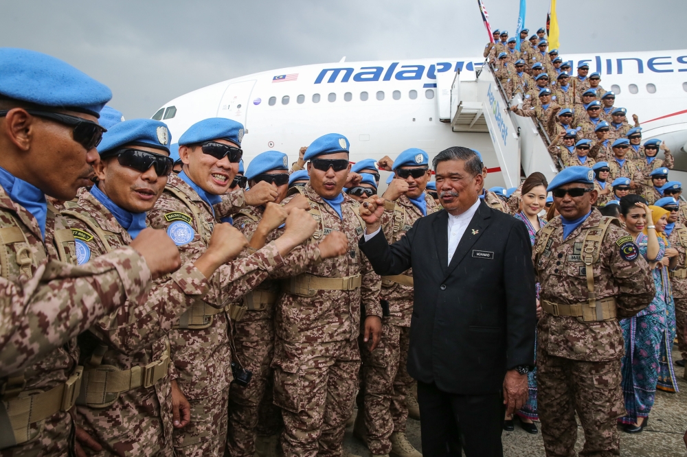 Then Defence Minister Mohamad Sabu greets the Malaysian Battalion 850-7 (MALBATT 850-7) during a ceremony before leaving to Lebanon at the Royal Air Force base in Subang in this file picture taken on October 1, 2019. He revealed that only four out of the 18 Sukhoi Su-30MKM fighter jets in Malaysia’s arsenal were airworthy. — Picture by Yusof Mat Isa