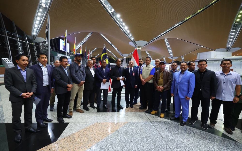 Foreign Minister Datuk Seri Zambry Abdul Kadir (seventh from left) poses for a group photo with the special reconnaissance team leaving for quake-hit Syria, at the Kuala Lumpur International Airport in Sepang February 14, 2023. — Bernama pic