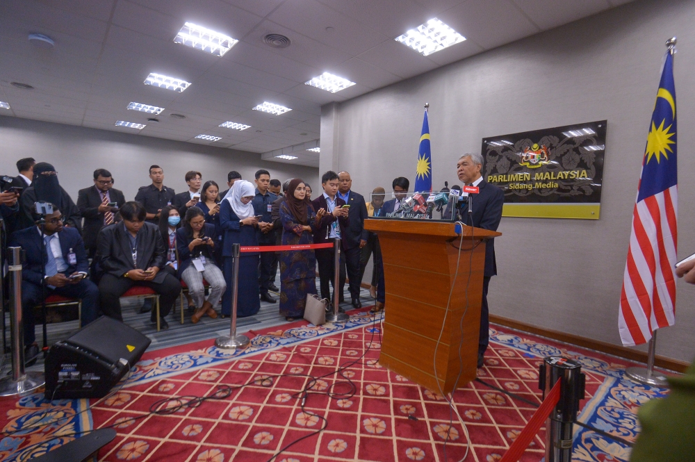 Deputy Prime Minister Datuk Seri Ahmad Zahid Hamidi speaks to the media during a press conference at Parliament in Kuala Lumpur February 15, 2023. — Picture by Shafwan Zaidon