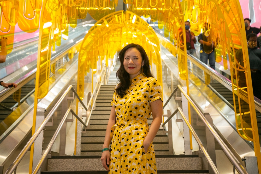 Architectural artist Pamela Tan and her installation ‘Sunnyside Up’ at the official launch of Arts on the Move in MRT Pasar Seni. — Picture by Raymond Manuel
