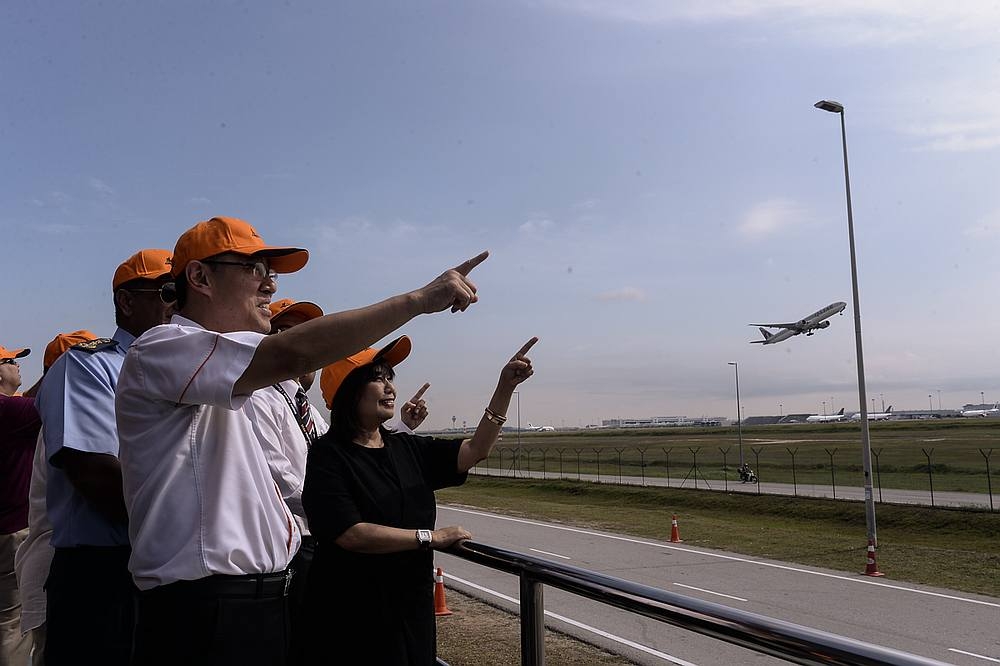 MAHB chairman Tan Sri Zainun Ali (right) and other company officials observe planes at the Anjung Spotter observation deck in KLIA, in this June 17, 2019 file photograph. — Picture Ahmad Zamzahuri