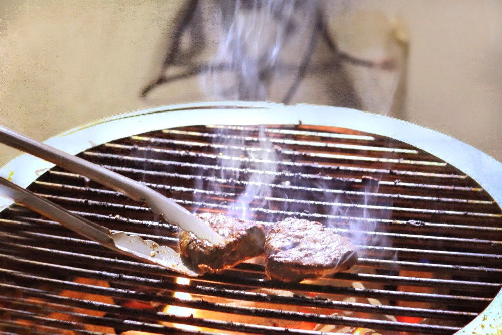 Watch the flames when grilling meat.